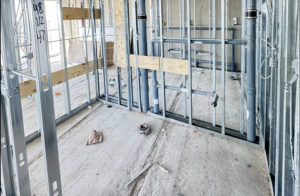 Professional plumber installing commercial drainage system in yoga studio in Toronto