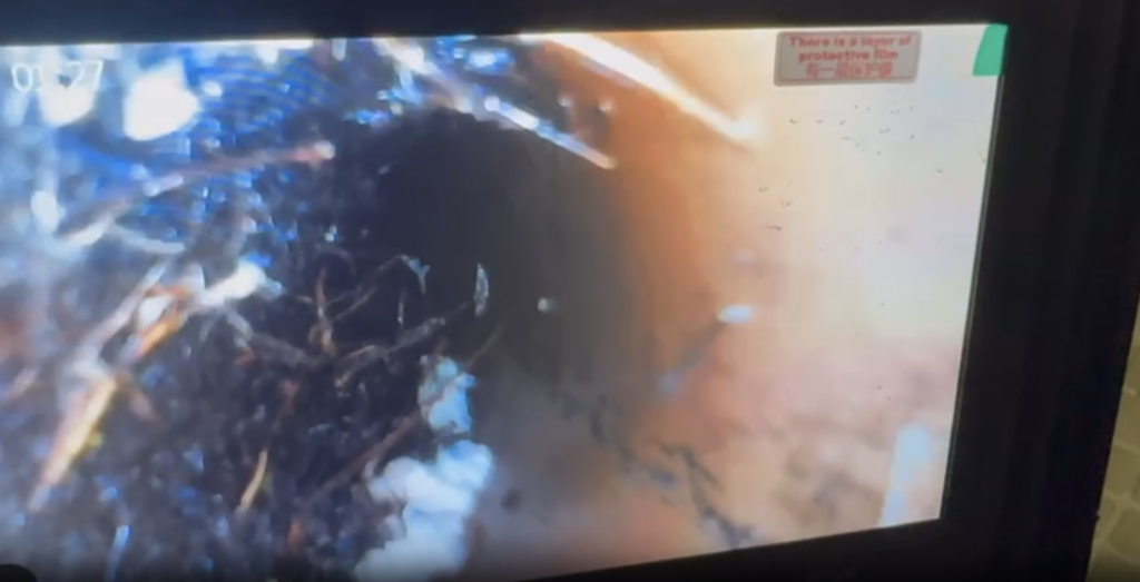 Professional plumber performing drain camera inspection and sewer line replacement for tree root damage in Toronto residential home